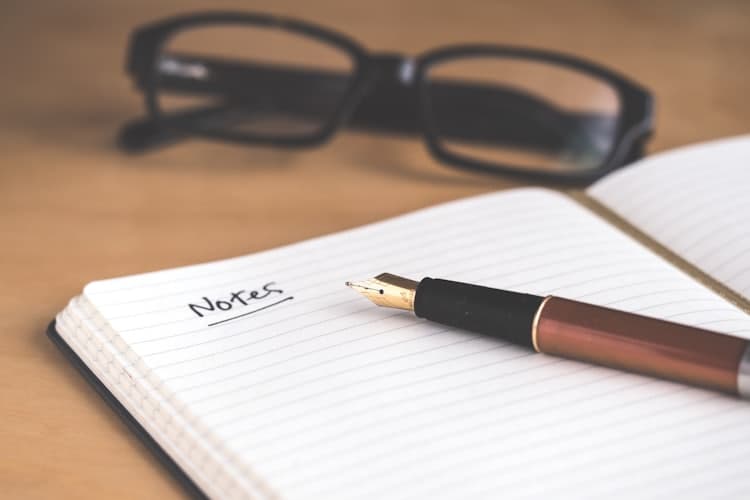 Open notebook with a fountain pen